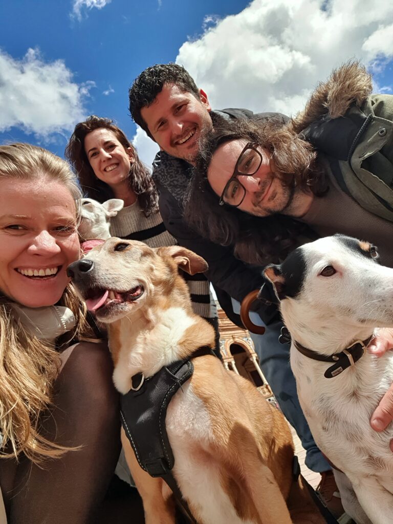 2 woman and 2 man with their 2 dogs.